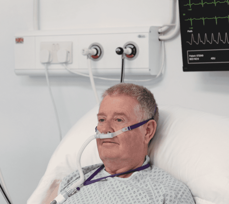 Image of a patient receiving HFOT delivered via a nasal cannula